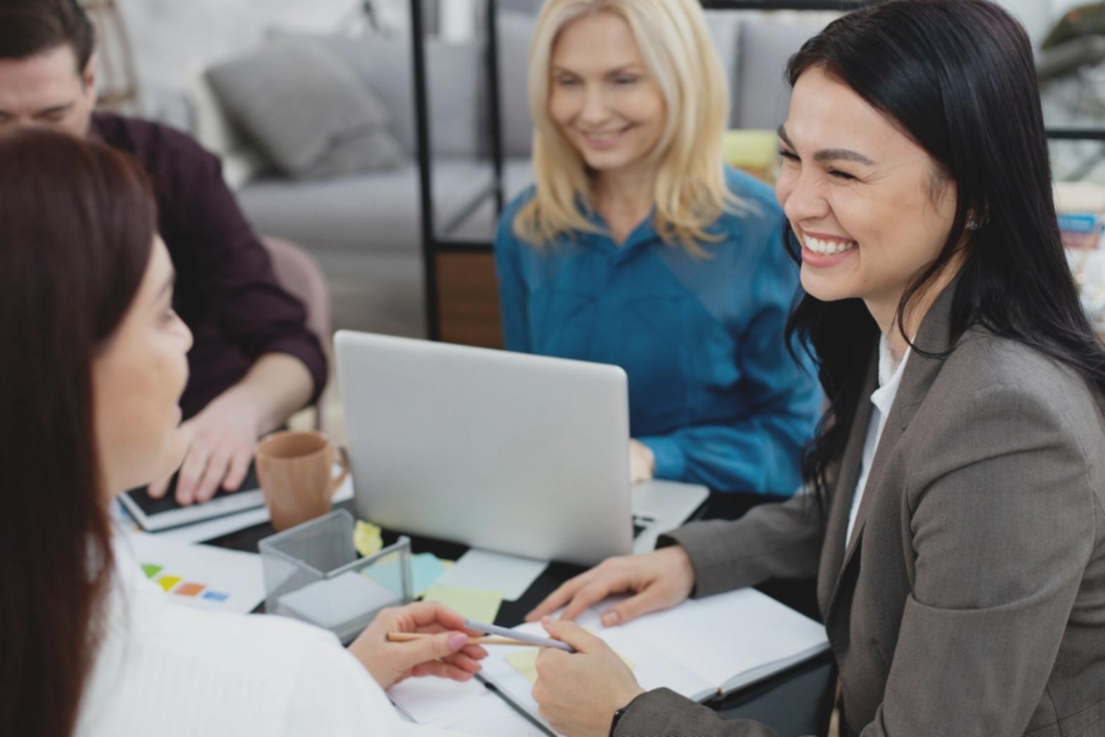 Modern office workspace with financial analysis tools and collaborative environment